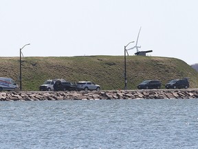 Police officers attend the scene where a pickup truck carrying four officer cadets entered the water at Point Frederick, Royal Military College on April 29, 2022. The cadets drowned as a result.