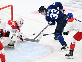 Czech Republic's goalkeeper Jakub Vondras and Finland's forward Jani Nyman vie for the puck during the bronze medal match between Czech Republic and Finland of the IIHF World Junior Championship in Gothenburg, Sweden on January 5, 2024.
