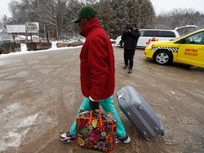 A refugee arrives at the Roxham Road border crossing to at the US-Canada border in Champlain, New York, on March 25, 2023.