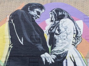 Artist Kevin Ledo’s mural of Johnny Cash and June Carter on the north wall of Budweiser Gardens appears to be complete in London on Thursday July 13, 2023. Cash proposed to Carter on stage during a concert in1968 at London Gardens. (Derek Ruttan/The London Free Press)