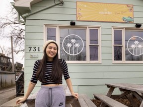 Ivy Pham stands in front of the former Beach Boy Burger restaurant at 731 Wellington St. in London that closed Dec. 30. Pham and her husband, chef Joseph Tran, are renovating the building as they plan to open Cintro, an Asian-fusion restaurant. Photo taken on Tuesday, Jan. 2, 2024. (Mike Hensen/The London Free Press)