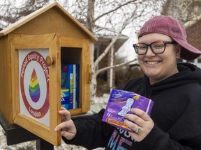 Stevie Brocksom of Shelborne Place in London has a free menstrual products library in a cute little wooden box in their front yard. Brocksom says it’s so well used they have to refill “every day.” Photo taken on Friday, Jan. 5, 2024. (Mike Hensen/The London Free Press)