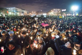 People attend a vigil for victims of the mosque