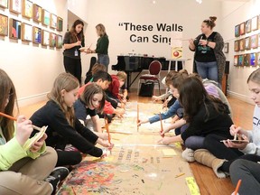 A class from St. Joseph's School in Simcoe participates in a workshop connected with the These Walls Can Sing exhibit at Lynnwood Arts in Simcoe.