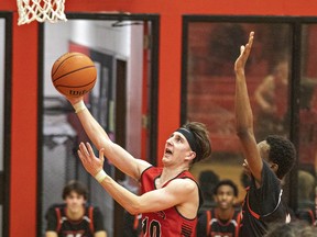 Nathan Halliday of the Paris Panthers executes a lay-up shot during an AABHN senior boys basketball game last week in Paris against the North Park Trojans. Brian Thompson/Brantford Expositor/Postmedia Network