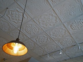 Stock photo of ceiling tiles, with a drop lamp