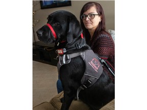 Jaime Hooper, who is legally blind and deaf, says she was denied a ride by an Uber driver last week in London because she had her guide dog, Hollie, with her. Hooper, seen here with Hollie on Saturday, Jan. 20, 2024, says her guide dog is "simply pivotal" in her life. (Mike Hensen/The London Free Press)