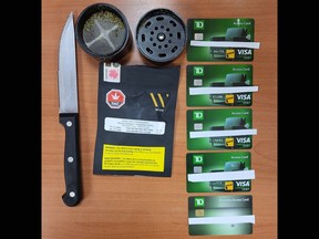 A knife, credit cards, and cannabis seized by the Ontario Provincial Police in Napanee, Ont., on Saturday, January 27, 2024.