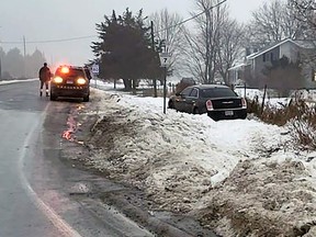 A vehicle driven off county road 7 near county road 2 in Loyalist Township, Ont., on Saturday, January 27, 2024. Ontario Provincial Police have charged the driver crimincally as a result.