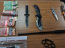Police seized weapons, suspected counterfeit currency and suspected drugs after searching for a Stratford home on Tuesday.