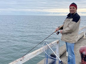 Open water as far as the eye can see. Vic Kaknevicius took advantage of the mild winter weather to do some fishing off the pier in Port Dover on Monday afternoon (Dec. 8). Decreasing ice coverage on the Great Lakes has the potential to cause greater shoreline erosion and declines in fish populations.