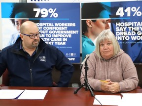 Dave Verch, left, an RPN and first vice-president of OCHU/CUPE, and Sharon Richer, secretary-treasurer of OCHU/CUPE, hold a press conference in Sudbury, Ont. on Monday January 8, 2024.