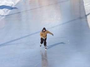 A lone skater glides across the ice at Queen's Athletic Field skating oval in Sudbury, On. Hours of operation are Monday to Friday from 4 p.m. to 10 p.m., and Saturdays and Sundays from noon to 10 p.m. Due to fluctuations in temperatures, hours of operation may change without notice. For updates, visit www.greatersudbury.ca/outdoorinks.