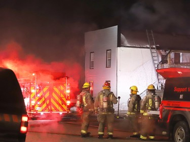 Firefighters battle a major fire at an apartment building in Capreol, Ont. on Wednesday January 24, 2024. John Lappa/Sudbury Star/Postmedia Network