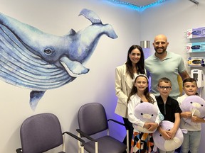 Thanks to the support of Nick and Janelle Foligno, the Pediatric Ambulatory Care Unit has undergone a major transformation into a child-friendly, under-the-sea theme. The Folignos and their children tour the unit. Supplied