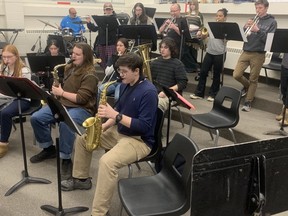 Members of the Jazz Sudbury Youth Band rehearse at Lo-Ellen Secondary on Monday night. Front row, from left, are Elliott Boyles, Joey Mackinnon and Peter Xiang; middle, from left, Sophia Jugo, Karly Thornton and Conner Fileatreault; back, from left, conductor Marc Taillefer, Justin Battisti, Dylan Watts-Lamframboise, conductor Peter Scherzinger, Kaela Tasker, Trina Baylosis, Quinn Roos and Charlotte Grenier. Jim Moodie/Sudbury Star