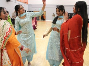 Women dance at Lohri