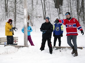 Justin Schmidt lets it fly in the horseshoe pit, a new event added to Sauble Beach's Winterfest for this year. Hundreds of people braved frigid temperatures for the two-day Winterfest celebration at the Sauble Beach Community Centre. Greg Cowan/The Sun Times