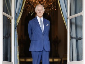 King Charles III was diagnosed Monday with 'a form of cancer' while being treated for a benign enlarged prostate.