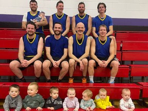 Basketball babies join their dads at a recent Sunday night Waterford Men's Basketball League game. (Top row left to right) Nick Rempel (holding Brielle Rempel), Rick Knelsen, Ben Rempel, Shawn Knelsen; middle row: Perry Wall, John Rempel, Henry Wall, Jay Knelsen; bottom row: Desmond Rempel, Dawson Rempel, Paxton Rempel, Avery Wall, Paisley Wall, Aspyn Wall and Payton Knelsen.