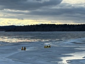Rescuers on the ice of the Kennebecasis River