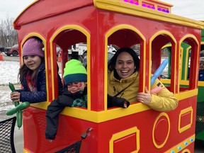 Shari and her kids Brolyn and Arabella enjoy a ride on a tiny train at the Walden Winter Carnival on Sunday. Jim Moodie/Sudbury Star