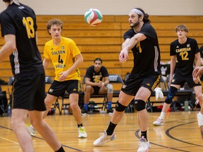 Members of the Cambrian Golden Shield men's volleyball team in action.