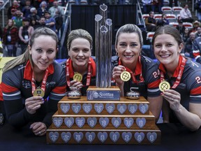 Team Ontario-Homan skip Rachel Homan, left to right, vice-skip Tracy Fleury, second Emma Miskew, lead Sarah Wilkes stand with the trophy after defeating Team Manitoba-Jones in the final at the Scotties Tournament of Hearts in Calgary, Sunday, Feb. 25, 2024.