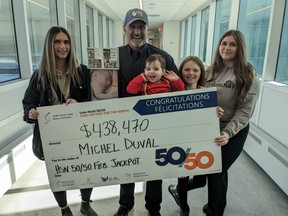 Michel Duval (centre) celebrated his February HSN 50/50 $438,470 grand prize win with his grandchildren on Saturday. Supplied