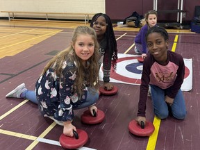 Students at Ecole catholique Felix-Ricard in Sudbury had fun learning how to curl in their school gymnasium recently as part of Curling Canada’s Rocks and Rings program. By gaining access to gymnasium-adapted equipment and through various drills, relays and team-building activities, students were able to experience curling without the ice. Teacher Lianne Kingsley was the lead organizer of the activity.