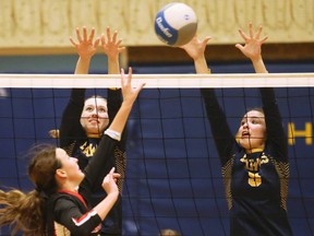 Chatham-Kent Golden Hawks' Rowan Agar (1) and Payton Cundle (5) combine for a block against the Northern Vikings in an LKSSAA senior girls AAA volleyball semifinal at Chatham-Kent Secondary School in Chatham, Ont., on Tuesday, Feb. 13, 2024. Mark Malone/Chatham Daily News/Postmedia Network