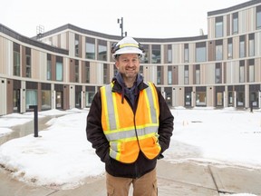 Derek Satnik, vice-president of technology and smart communications with s2e Technologies, stands in front of a round condominium building at Eve Park in west London.  The innovative project in the city's first net-zero community was recently ranked by CNN as one of the 10 most influential architectural projects in the world.  Photo taken on Wednesday, Jan.  24, 2024. (Derek Ruttan/The London Free Press)