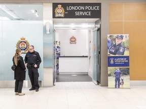 Superintendent Blair Harvey speaks with off-duty Const. Jodi Hillman outside of the London Police Service’s new community engagement centre at Masonville Place in London, Ont. on Friday, Feb. 9, 2024. (Derek Ruttan/The London Free Press)