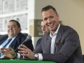 Marc Methot, right, shares a story of his time with the London Knights with Jim McKellar and Billy Carroll as the trio is inducted into the team's Don Brankley Hall of Fame at Budweiser Gardens in London on Friday, Feb. 16, 2024. (Mike Hensen/The London Free Press)