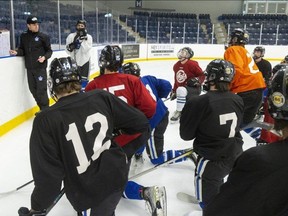 London Nationals assistant coach Rob Drummond lays out a drill at practice at the Western Fair Sports Centre on Tuesday, Feb. 20, 2024. (Mike Hensen/The London Free Press)