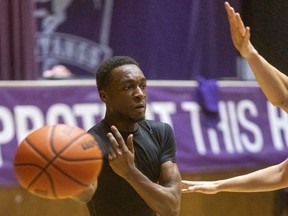 Noah Otshudi handles the ball at a Western Mustangs men's basketball practice at Alumni Hall in London on Wednesday, Feb. 21, 2024. Otshudi is one of a number of second-year players who helped the Stangs go 16-6 in the regular season. (Mike Hensen/The London Free Press)