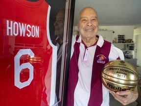 Barry Howson of Sarnia shows off his jersey that he received from Canada Basketball for being the first Black athlete to represent Canada at the Olympics in 1964 in Tokyo. Photo taken on Tuesday, Feb. 27, 2024. (Mike Hensen/The London Free Press)