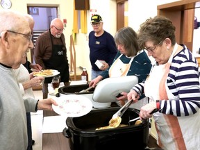 Everyone was busy serving, talking, and eating hot, fresh pancakes at Grace United Church on Shrove Tuesday. Lorraine Payette/for Postmedia Network