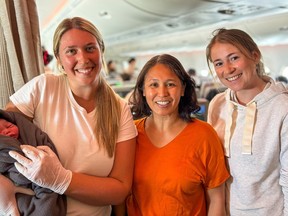 Nurse Lindsey Kilgore (left – from the Kingston Health Sciences Centre (KHSC) neonatal intensive care unit (NICU)), her friend Eunice (middle) and Lena (right – a medical resident from Austria) worked together to deliver and resuscitate a baby aboard a plane. supplied by Kingston Health Sciences Centre