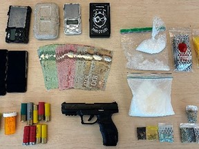A replica firearm, fentanyl, crystal methamphetamine, cash, and other substances seized by Kingston Police on Tuesday, February 6, 2024.