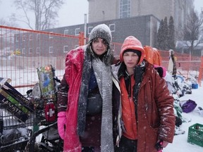 Melissa Lynch, known as "Ma" (left) and Jen Murphy, who are currently homeless, are photographed outside Bridge Street United Church, in Belleville, Ont., on Feb.15, 2024. The city recently declared a state of emergency after responding to a flurry overdoses in just 24 hours. (The Canadian Press)
