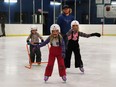 Austin Johner and kids (l-r) and Avery, Serayah and Gemma-Lynn went to the Mayerthorpe Exhibition Centre on Monday for Free Family Skating. The Kinette Club sponsored the event for Family Day.