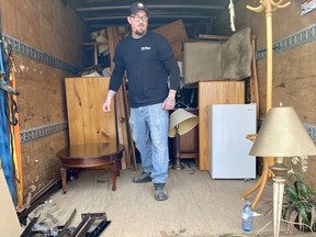 Tyler St. Pierre from Stratford's Habitat for Humanity ReStore organizes one of the trucks used to haul furniture from the Queen's Inn's 32 rooms before renovations. (Cory Smith/Beacon Herald)