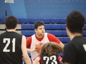 Edward Zalewski, with the Sarnia Heat, sets up for a pass during play Saturday at a Special Olympics Sarnia basketball tournament at Lambton College.