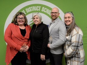 Joan Maloney, second from left, a retired educational assistant, got the help she needed while having a stroke thanks to the quick action of Grand Erie educators Pamela O'Halloran, left, David Gervais and Adriana Potichnyj.