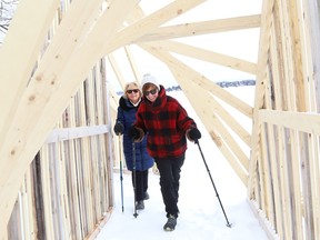 Cathy Zinger, left, and Andrea Dumas check out one of four ice stations at Bell Park in Sudbury, Ont. on Tuesday February 20, 2024. The structures are designed and built by first-year students from the McEwen School of Architecture.