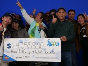 Warehouse workers from the GTA collect their Lotto Max winnings.