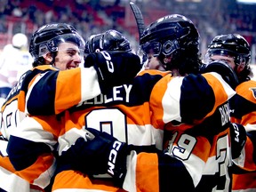 All smiles as Ethan Burroughs (left) Sam Sedley, Colby Barlow and Deni Goure celebrate Sedley's record-breaking assist in the first period as the Owen Sound Attack host the Oshawa Generals inside the Harry Lumley Bayshore Community Centre on Tuesday, Feb. 13, 2024. Greg Cowan/The Sun Times