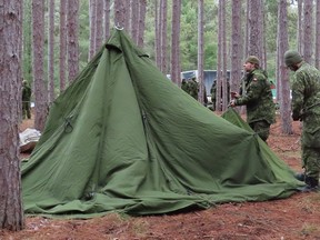 Troops practice setting up tents and operating stoves, used for cooking and warmth, at CFB Borden on Saturday, Feb. 10, 2024, in preparation for a training exercise at at Moosonee next month. Photo supplied.