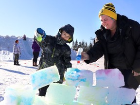 Glen, eight, and mom Shannon Roberts from Whitecourt coloured the ice blocks while building an igloo at the Family Day Winter Carnival. The Town of Whitecourt hosted the event at Festival Park on Saturday afternoon.